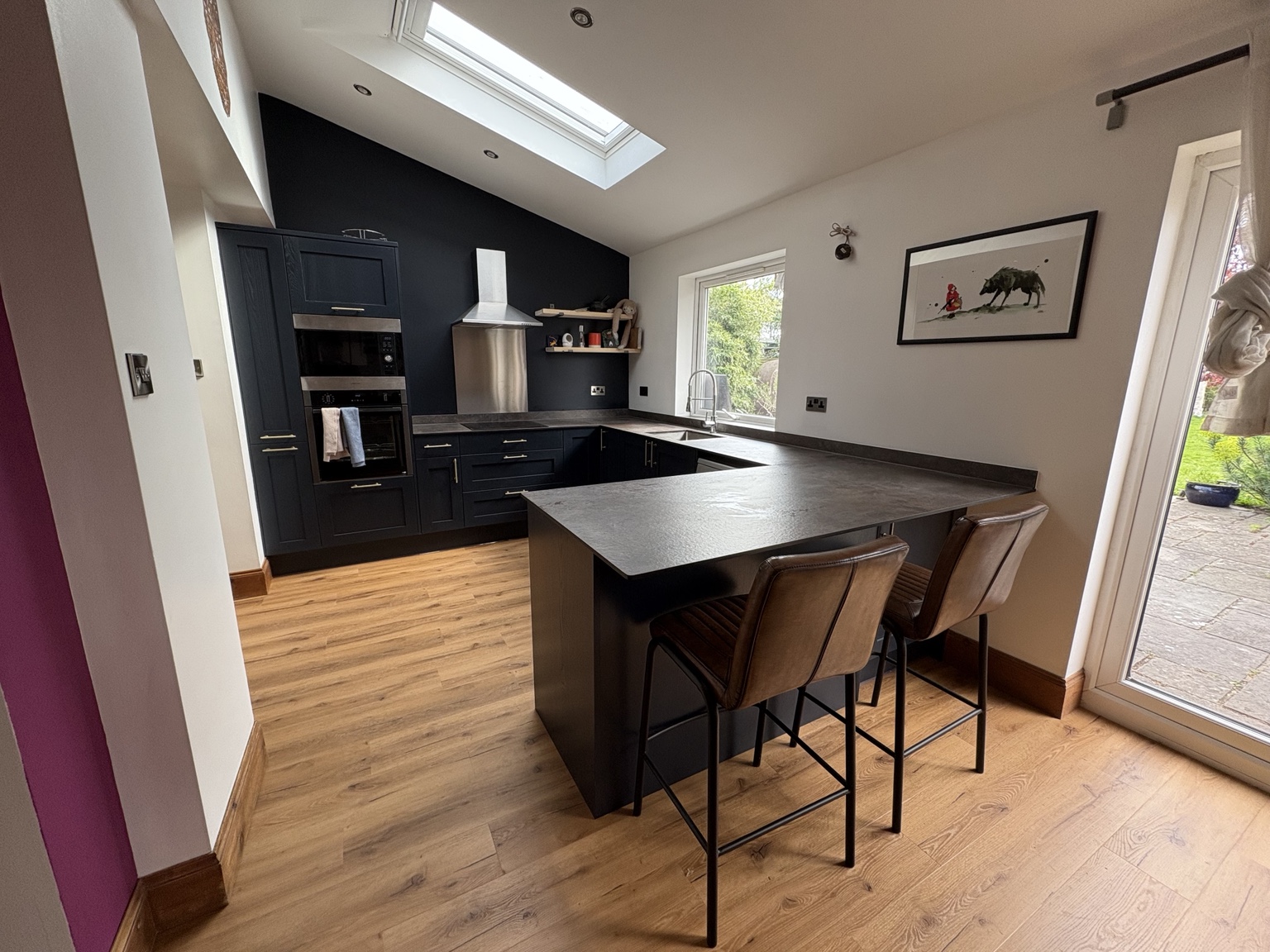 Dark shaker kitchen with peninsula